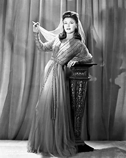 A Model Wearing A 1940s Style Evening Gown Metal Print