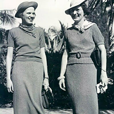 Two smile women with tops