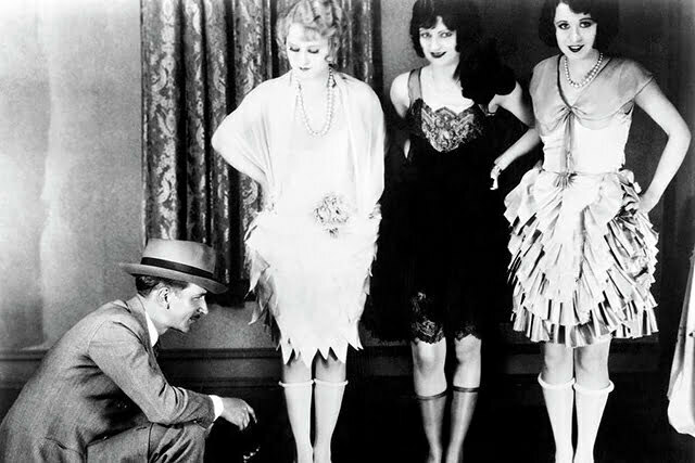 Three women with a man