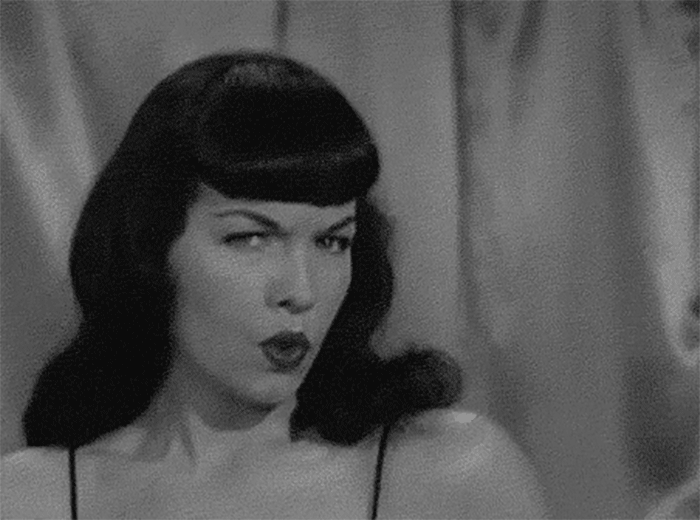 Thick, short Bettie Page bangs